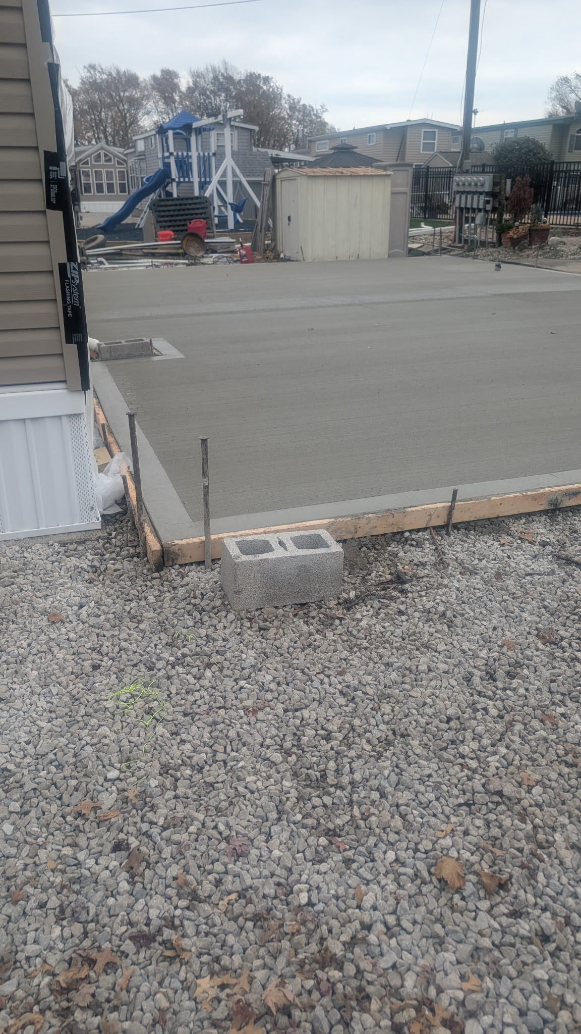 Side view of residential concrete flatwork with forms in place.