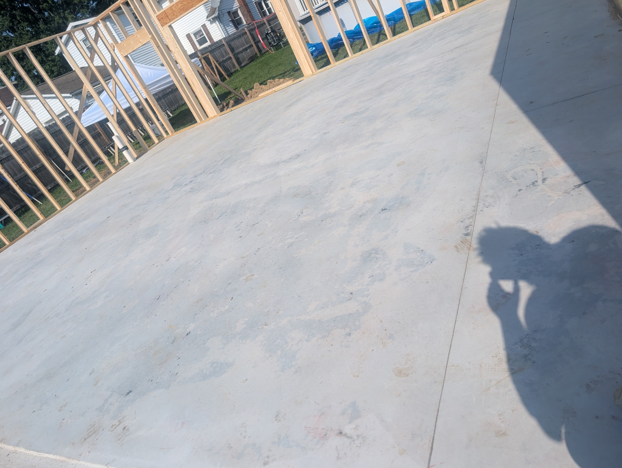 Concrete floor within a building under construction.
