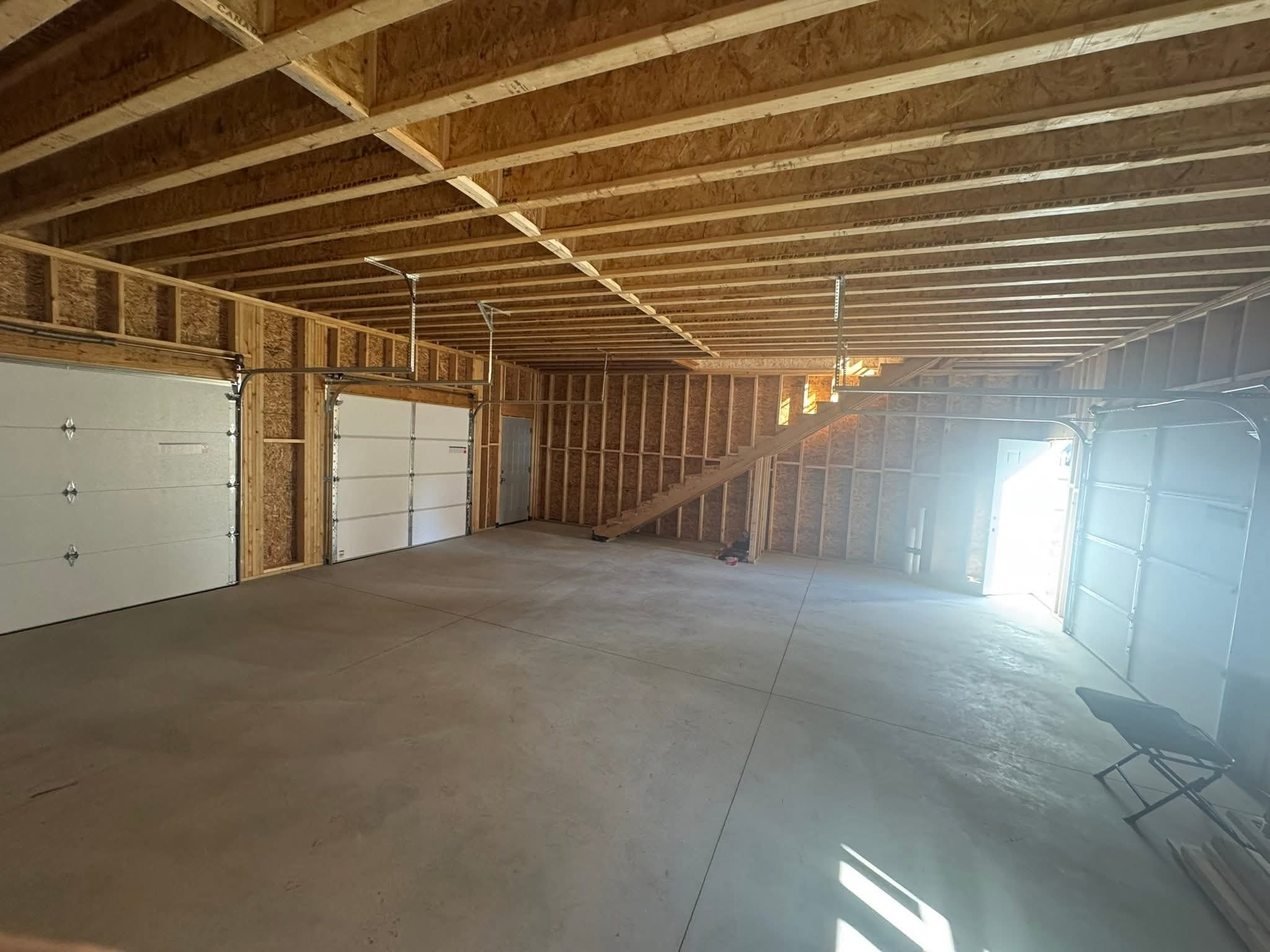 Interior concrete garage floor with visible control joints.