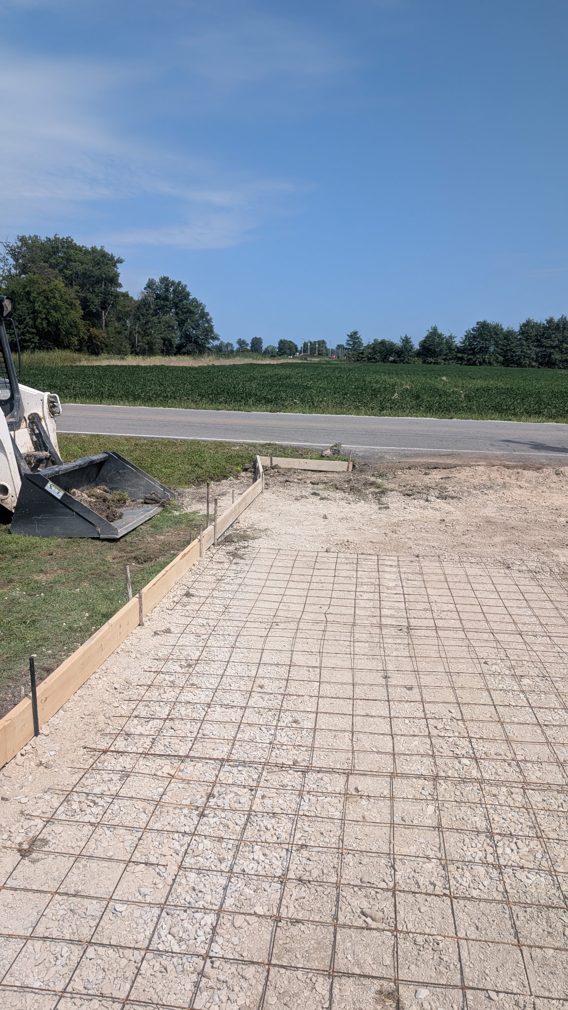 Aggregate base, forms and reinforcement before concrete placement.