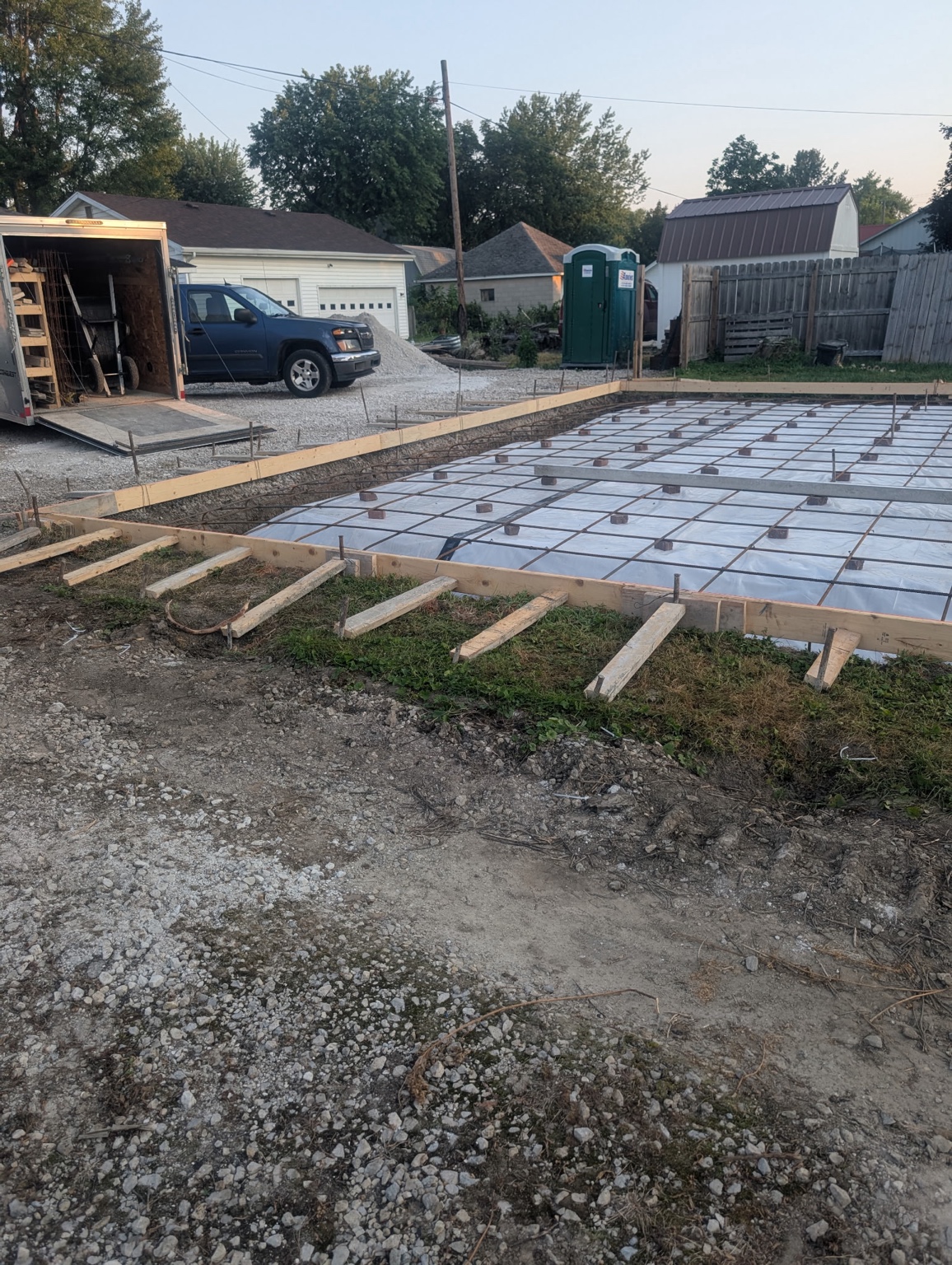 Forms, reinforcement and membrane visible before concrete placement.